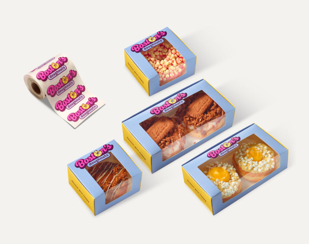 Boxed assorted doughnuts with colourful packaging